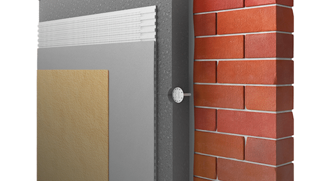 Cutaway diagram of an external wall insulation system showing multiple layers including adhesive, insulation board, reinforcement mesh, basecoat, and topcoat applied to a brick wall.