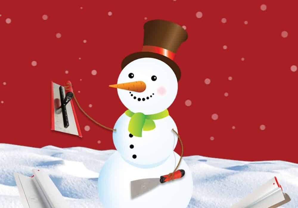 Cartoon snowman holding two plastering tools (a trowel and a hawk) in a snowy landscape with a red snowy background. The snowman wears a top hat, green scarf, and has a carrot nose. Two additional plastering tools are placed in the snow around it.