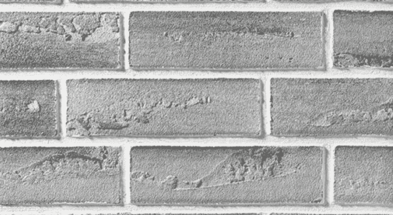 Grey brick slips used as a decorative finish for external wall insulation systems, offering the appearance of traditional brickwork with reduced weight and improved insulation compatibility.