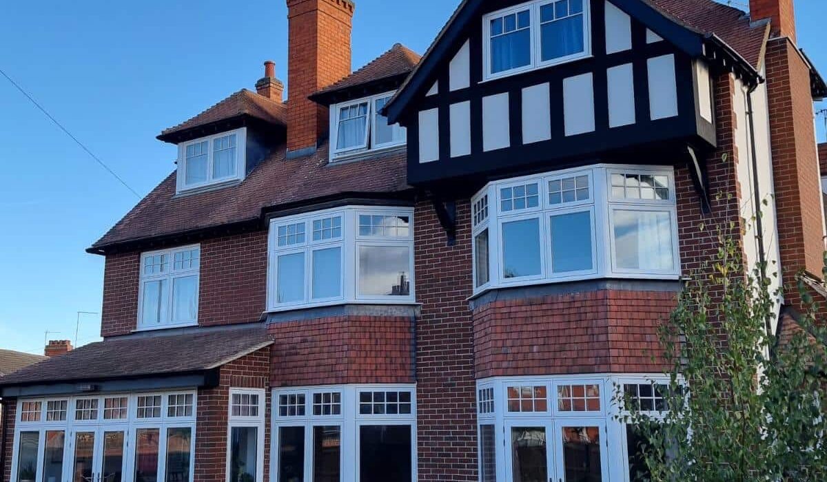 Large refurbished residential property with a combination of traditional brickwork and freshly rendered upper walls, showcasing the use of high-quality insulation and render materials supplied by EWI Store – a trusted company specialising in external wall insulation and professional rendering systems.