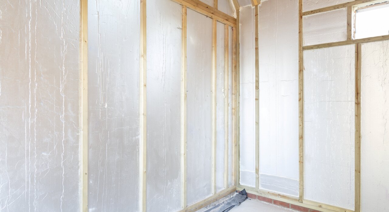 Interior view of a timber-frame structure with foil-backed rigid insulation boards fitted between the studs. This reflective insulation helps improve thermal performance by reducing radiant heat loss. Ideal for low-energy or airtight builds, these boards can be paired with EWI Store’s ventilated render-only systems to deliver a complete, high-performance building envelope.