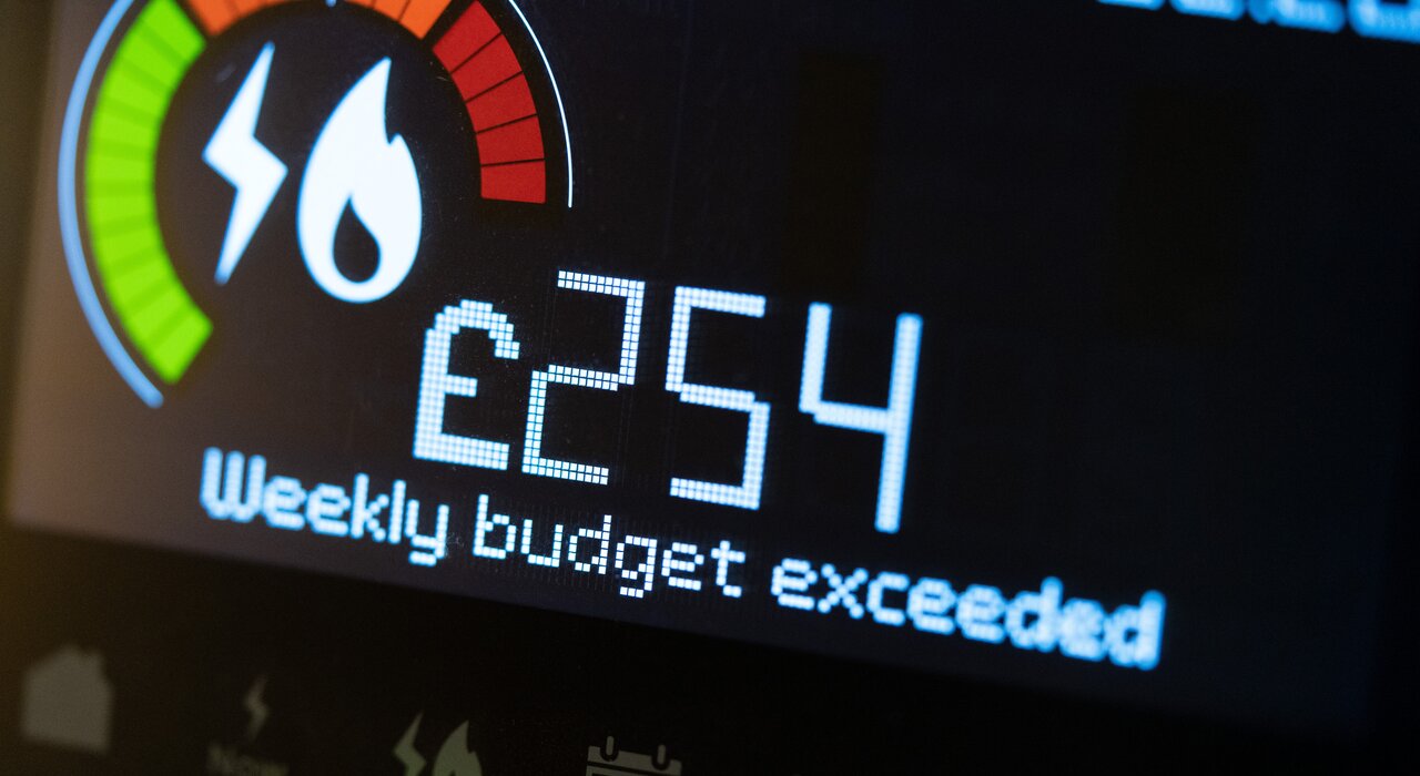 A digital smart meter display showing high energy consumption (£254) with the message “Weekly budget exceeded.” This illustrates the importance of energy-efficient upgrades like EWI to reduce heating demand and energy costs—key goals supported by EWI Store insulation systems.