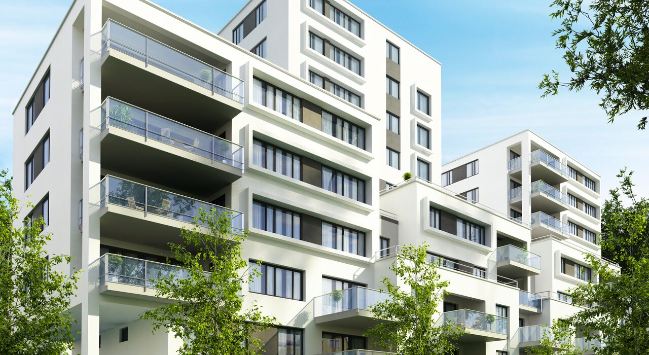 Modern apartments with large windows and balconies highlight the need for continuous external insulation to maintain energy efficiency in multi-storey buildings.