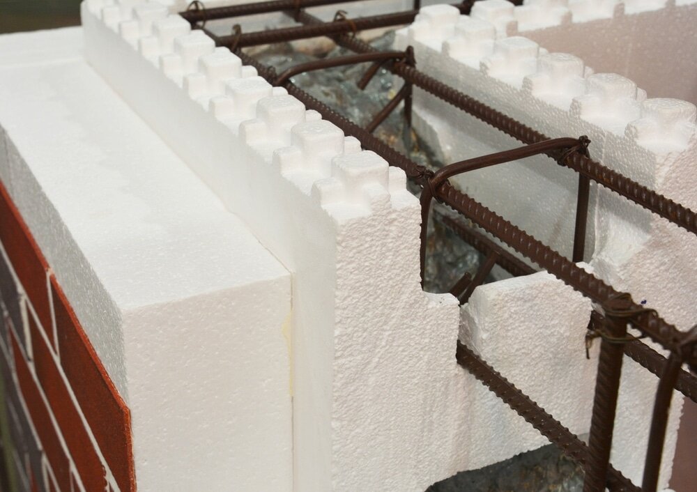 Expanded polystyrene blocks with reinforcement, ready for concrete. These are used in insulated concrete forms (ICFs), and can be paired with external wall insulation for added performance.