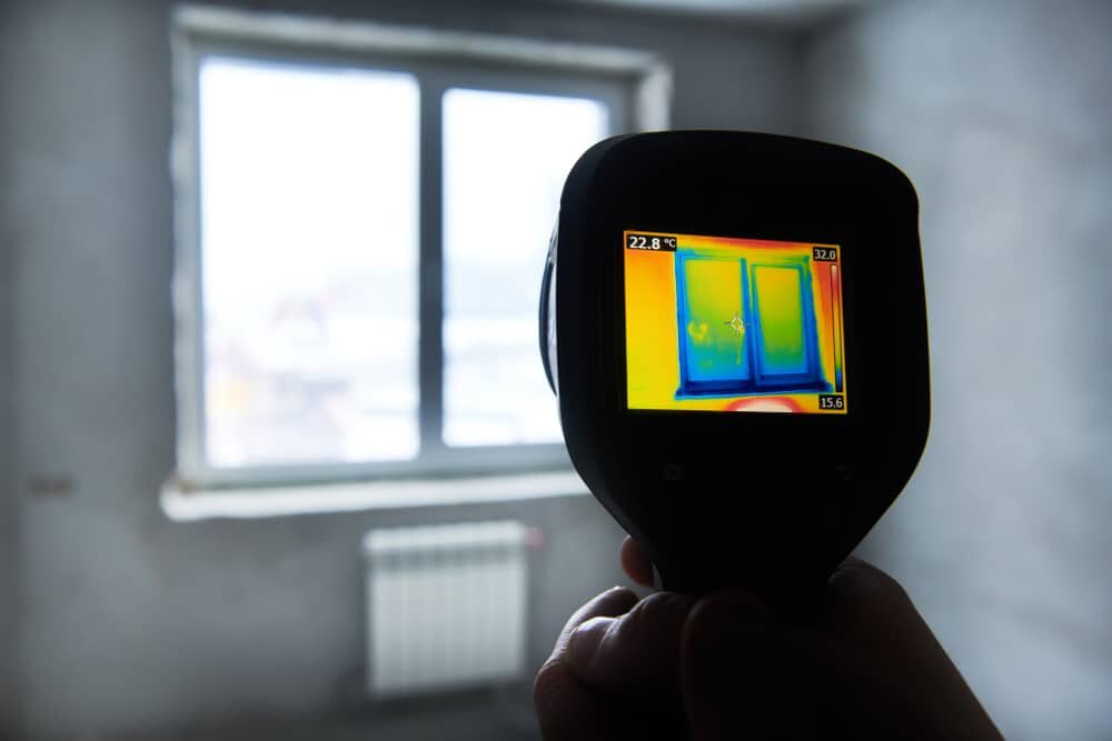  Thermal imaging showing significant heat loss around a window in an uninsulated room. Proper insulation, such as EWI Pro systems available from EWI Store, can help eliminate cold spots, improve energy efficiency and reduce heating costs.