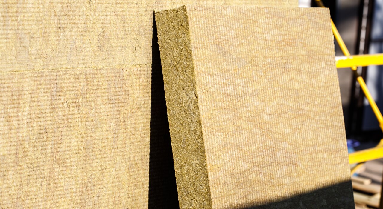 Close-up of mineral wool insulation boards stacked and ready for installation. This fire-resistant and breathable material provides excellent thermal and acoustic performance. Available from EWI Store, our range of Rockwool and other mineral wool solutions are ideal for both EWI and internal applications, ensuring long-term energy efficiency and safety.