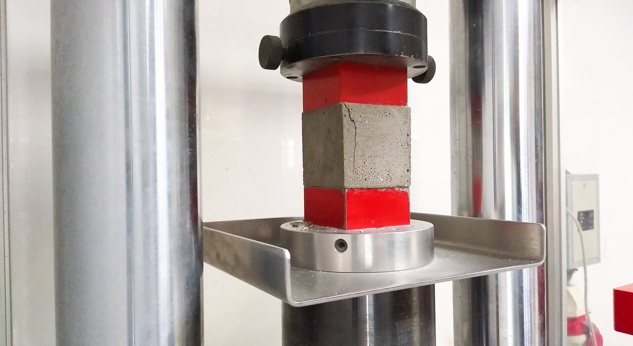  Laboratory test of compressive strength on a concrete cube using a hydraulic press. EWI Store offers certified products that meet the highest performance standards—ensuring structural reliability and compliance across all systems.