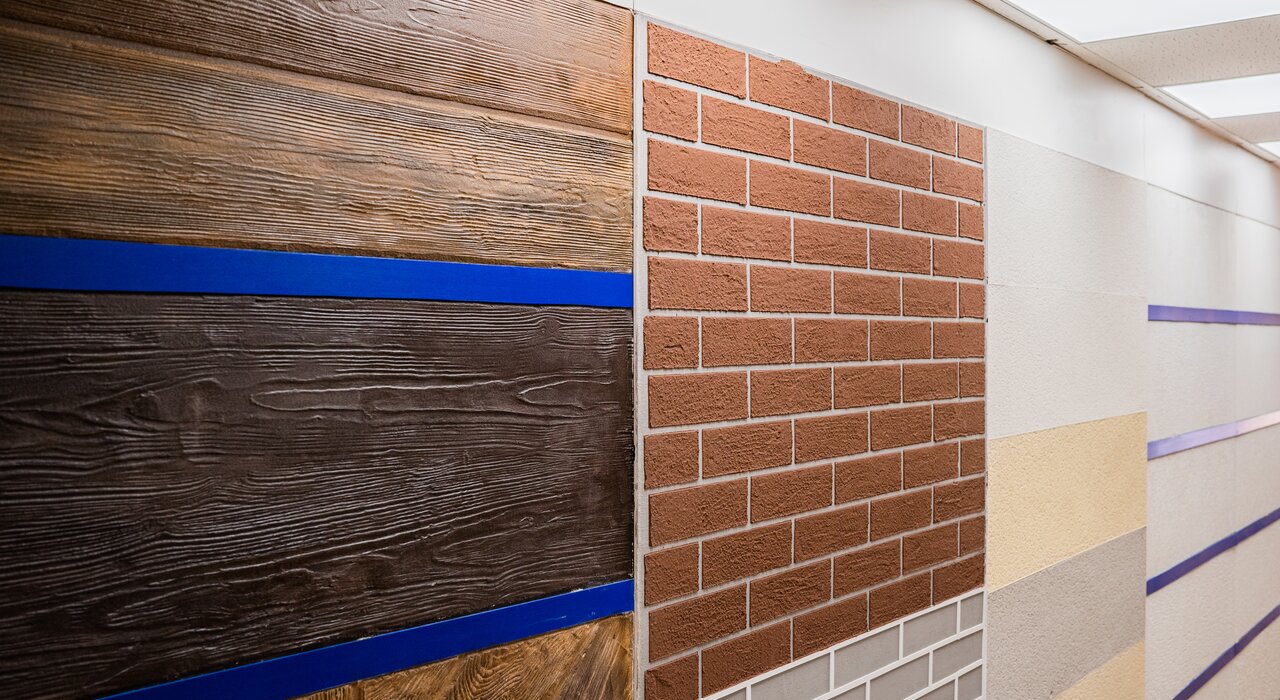 Close-up of various EWI Pro render finishes displayed in a sample layout. Featuring Silicone Render, Mineral Render, and Wood Effect Render, these advanced systems offer a wide range of textures and colours to suit any project. Available through EWI Store, our render range ensures high-performance, durable finishes with excellent weather resistance and breathability.