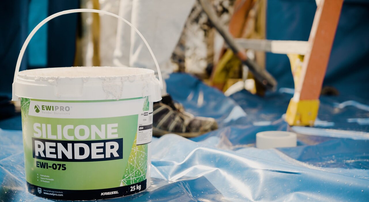 Bucket of EWI Pro Silicone Render (EWI-075) prepared for application. This premium render is ready-to-use and ideal for external wall insulation systems, offering excellent weather resistance and colour retention. Available from EWI Store in a wide range of shades to match your project requirements.