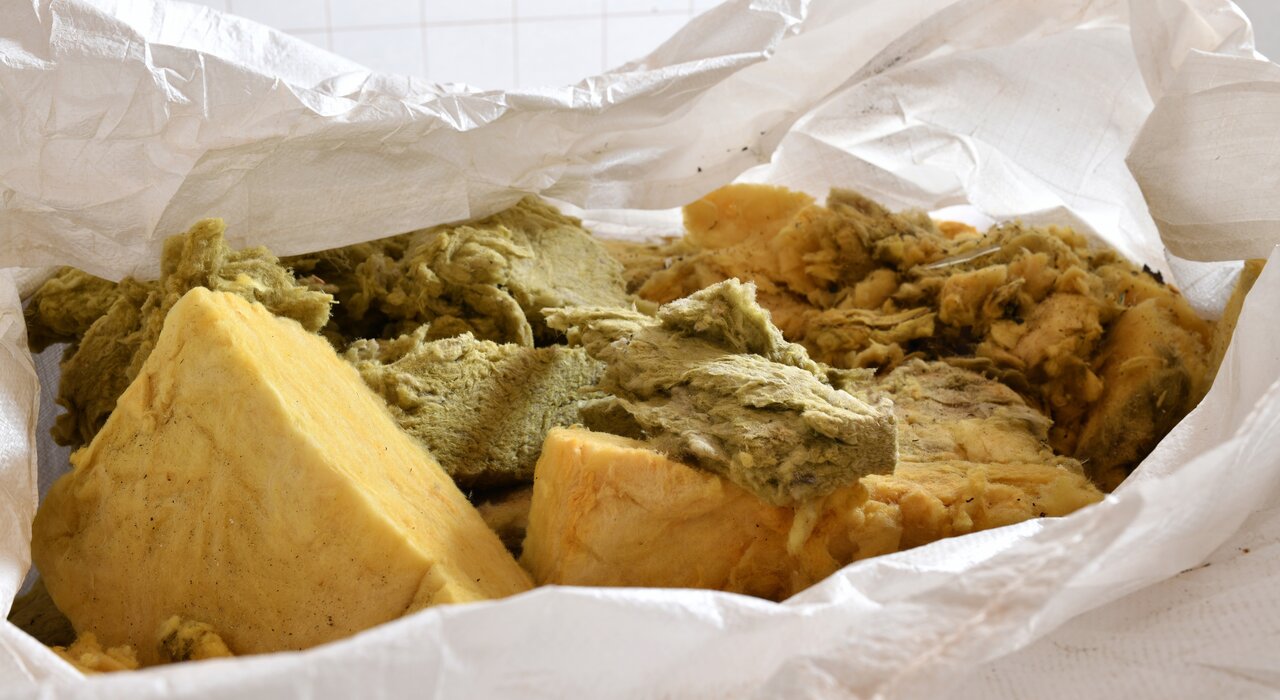 Bag of mixed mineral wool insulation offcuts ready for disposal. EWI Store offers a range of insulation boards including Rockwool and EPS, ensuring optimal thermal performance and ease of installation. Trust EWI Store for complete insulation system solutions.