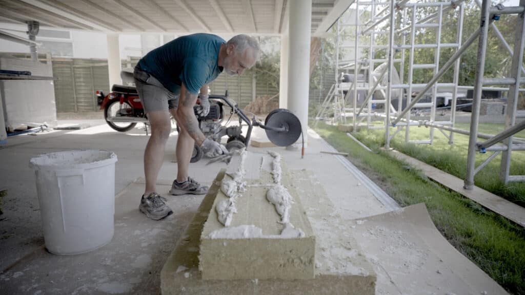 Perimeter of adhesive being applied to Rockwool